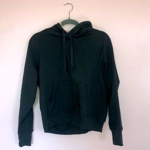 Dark green fuzzy hoodie with front pocket abs finger holes.